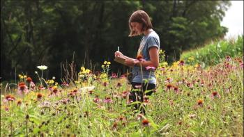 Ally Brown in field of wild flowers
